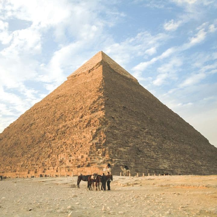 The Great Pyramid of Giza under a blue sky